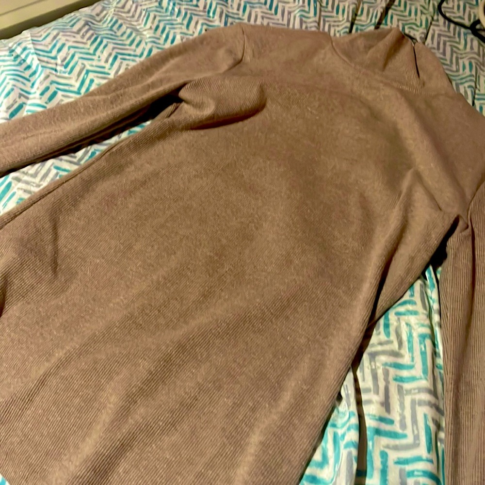 Beige medium in womens, turtle neck and has long sleeve